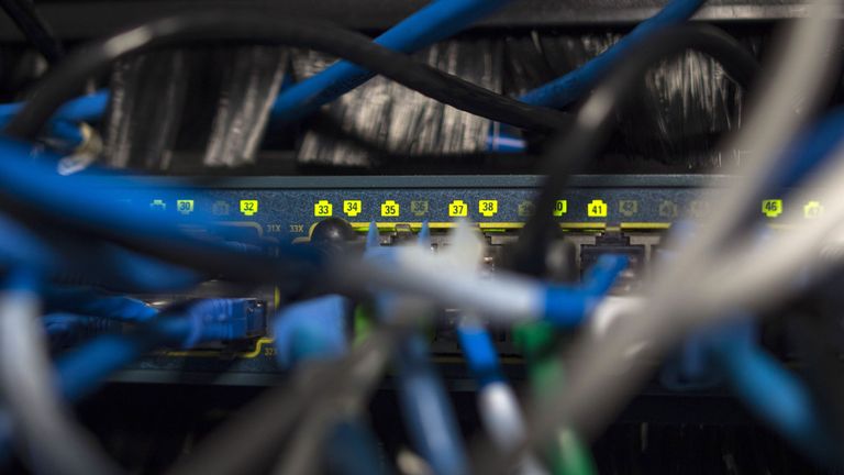 Network cables are seen going into a server in an office building in Washington, DC on May 13, 2017