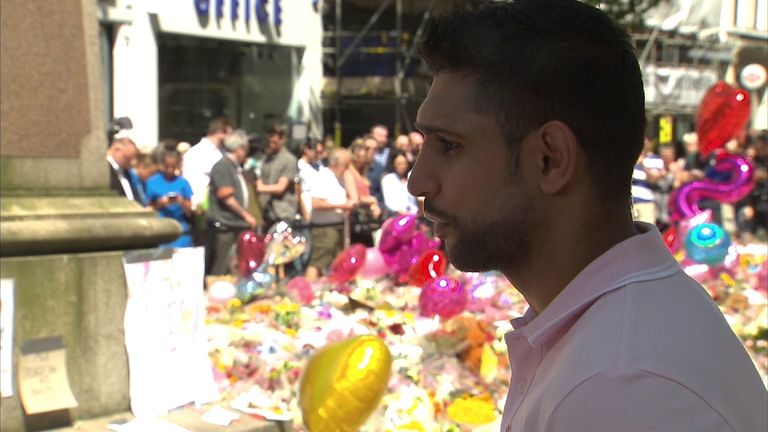 Boxer Amir Khan paid his respects to the people killed in the Manchester attack