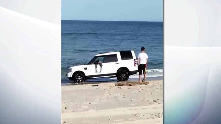 The car became stuck after the driver drove it down to the shoreline