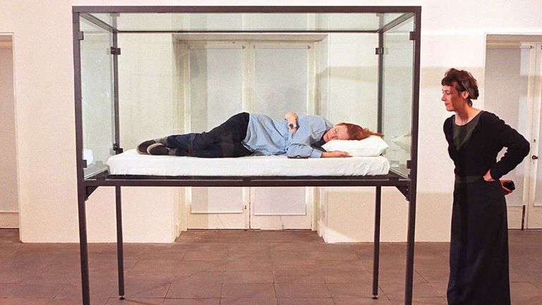 Actress Tilda Swinton sleeps in a glass box as part of an installation conceived by Cornelia Parker