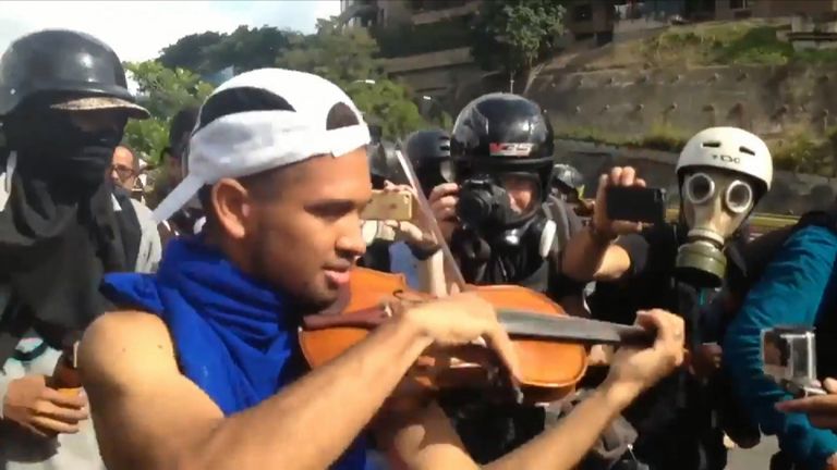 Protester plays violin amid anti-government march in Venezuela