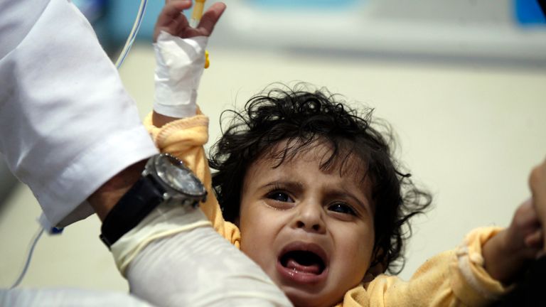 A Yemeni child receives treatment for suspected cholera at a hospital in Sanaa
