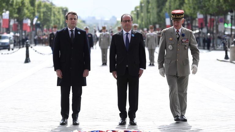 Francois Hollande (C) and French president-elect Emmanuel Macron (L) mark the 72nd anniversary of the victory over Nazi Germany during WWII