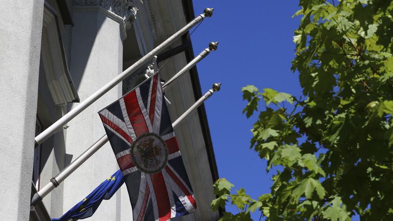 The Union flag flies at half-mast outside the British embassy in Minsk, Belarus