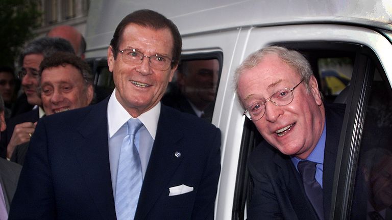 Here he poses with fellow British actor Michael Caine in 2000