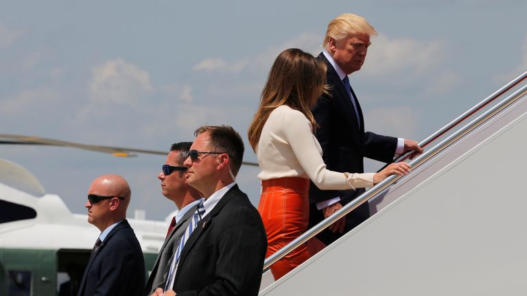 President Trump boards Air Force One with First Lady Melania Trump