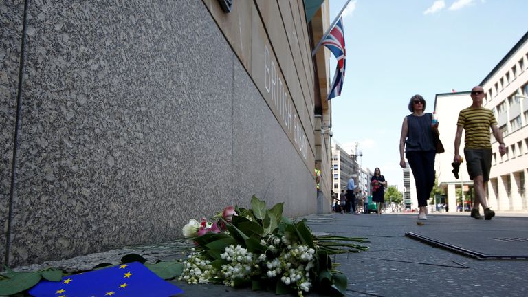 Flowers are left in tribute outside the British embassy in Berlin, Germany