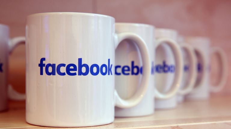 Coffee mugs adorned with the Facebook logo stand at the Facebook Innovation Hub on February 24, 2016 in Berlin, Germany. The Facebook Innovation Hub is a temporary exhibition space where the company is showcasing some of its newest technologies and projects