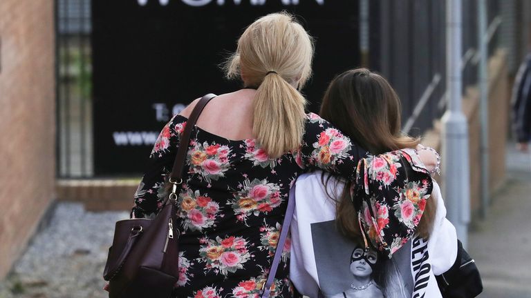 Ariana Grande concert attendees leave the Park Inn where they were given refuge after last nights explosion at Manchester Arena 
