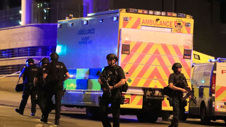 Armed police at Manchester Arena after reports of an explosion during an Ariana Grande gig