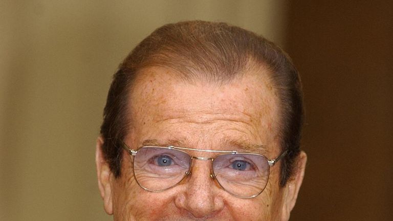 2003: Roger Moore receives his knighthood 