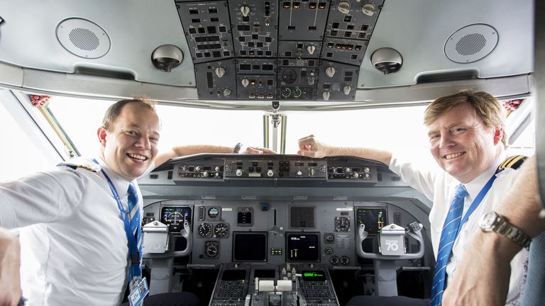 Dutch King Willem-Alexander sitting inside the cockpit of a KLM Cityhopper, next to pilot Maarten Putman, at the Schiphol Airport, near Amsterdam
Dutch King Willem-Alexander, who works part-time as a commercial pilot, is to start conversion training to fly Boeing 737 passenger jets, a Dutch newspaper reported on May 17. The conversion training will mean the royal can continue to fly 