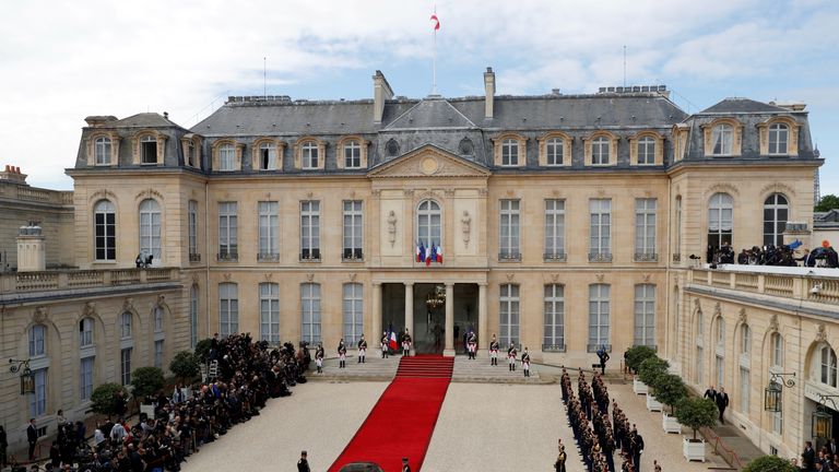 The Elysee Palace with the red carpet in the courtyard during the handover ceremony 