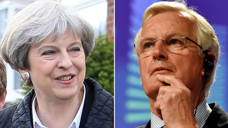 Theresa May and  Michel Barnier