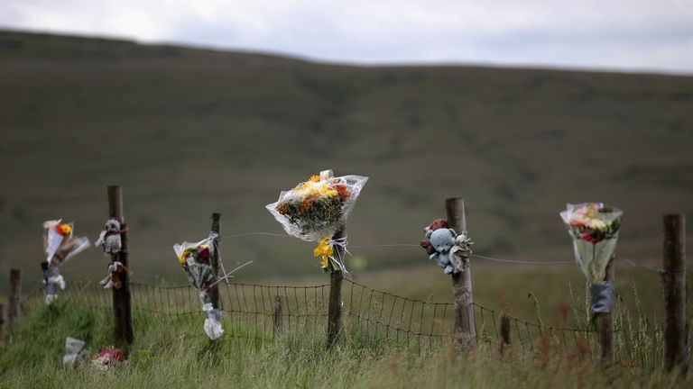Floral tributes overlook Saddleworth Moor where the body of missing Keith Bennett may be buried on June 16, 2014 in Saddleworth, United Kingdom