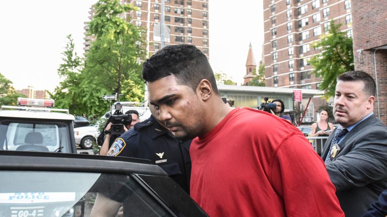 Richard Rojas is escorted from the 7th precinct by New York City Police officers after being processed in connection with the speeding vehicle that struck pedestrians on a sidewalk in Times Square in New York City, U.S. May 18, 2017