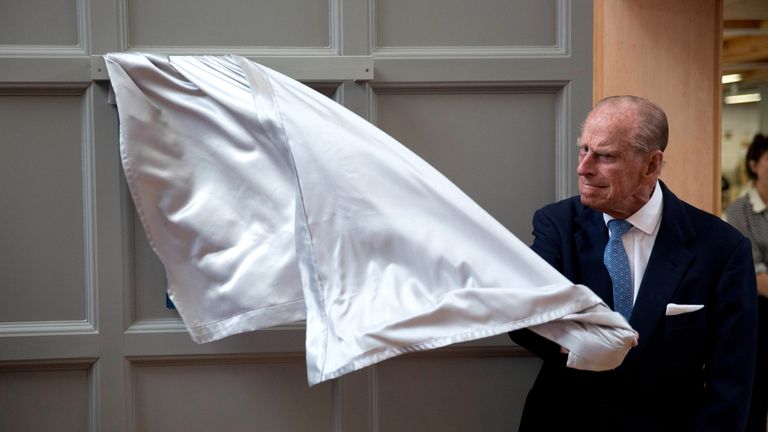 Prince Philip has difficulty unveiling a plaque at one of his regular engagements. 