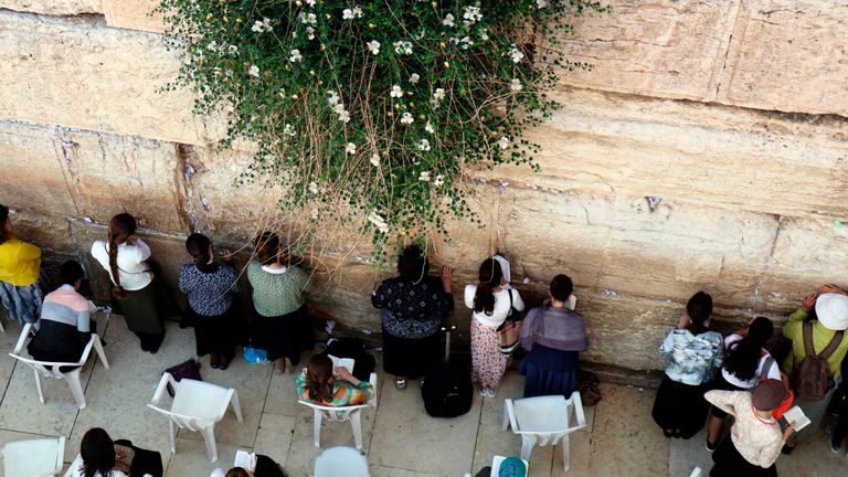 Jewish women pray at the women&#39;s section of the Western Wall in the old city of Jerusalem on May 16, 2017.
