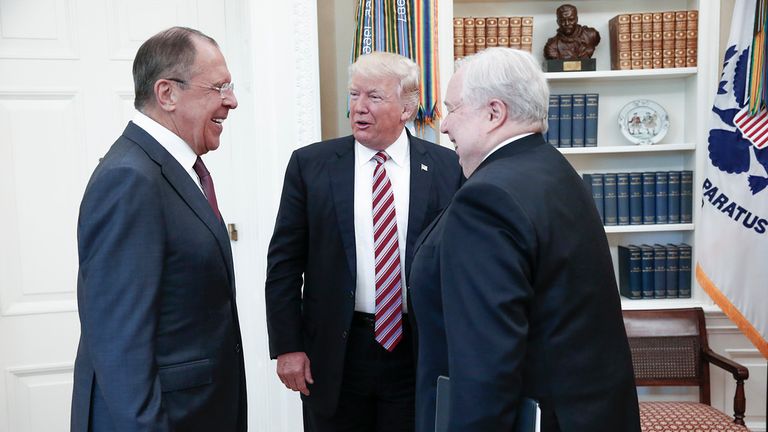 During a break Mr Trump jokes with Mr Lavrov (left) and Ambassador Sergei Kislyak (right). MFA Russia