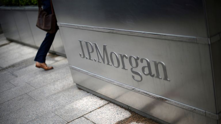 A man walks into the JP Morgan headquarters at Canary Wharf in London