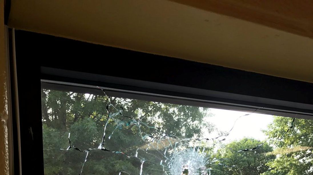 A bullet hole in a window after a gunman opened fire on Republican members of Congress 