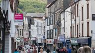 People past shops and businesses on May 5, 2017 in Pontypridd, Wales
