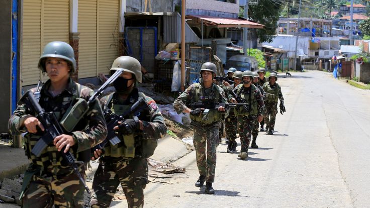 Government soldiers conduct a foot patrol after a security inspection, as they continue their assault against insurgents from the Maute group, who have taken over large parts of Marawi City, Philippines June 17, 2017