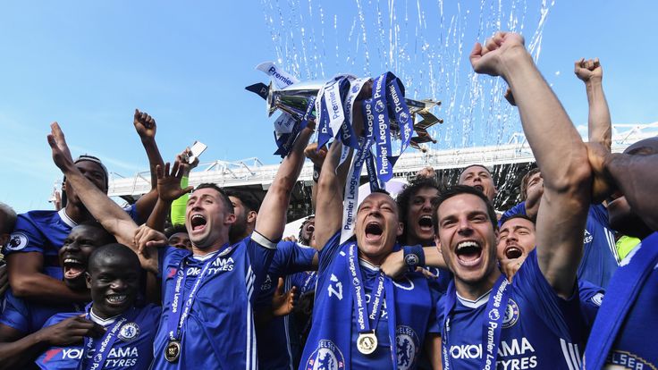 A jubilant Chelsea celebrate with the Premier League Trophy