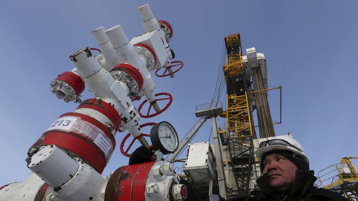  A worker checks a pressure gauge at an oil pumping station owned by Rosneft in the Suzunskoye oil field, near Krasnoyarsk, Russia