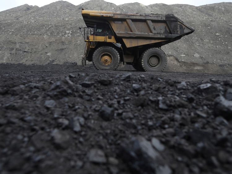 Dump trucks haul coal and sediment at the Black Butte coal mine outside Rock Springs, Wyoming, U.S.