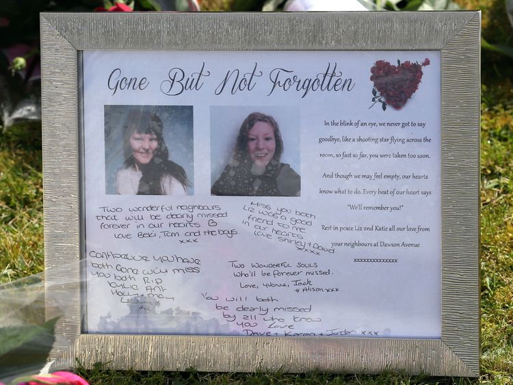 Tributes left outside a house in Spalding, Lincolnshire, where the bodies of 49-year-old Elizabeth Edwards and 13-year-old Katie were found