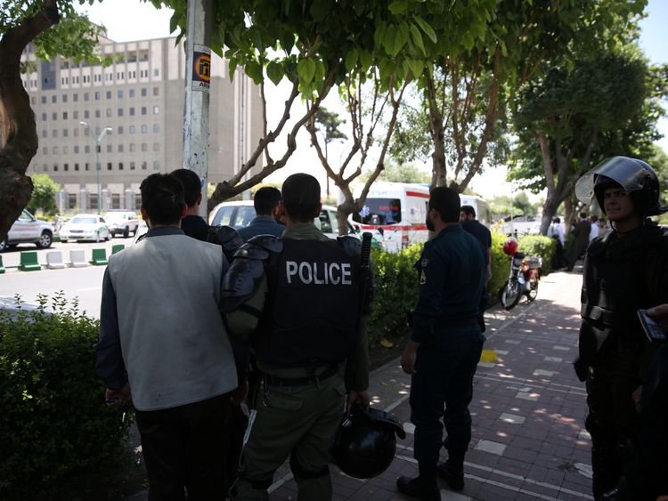 Iranian police near Tehran&#39;s parliament building during the attack