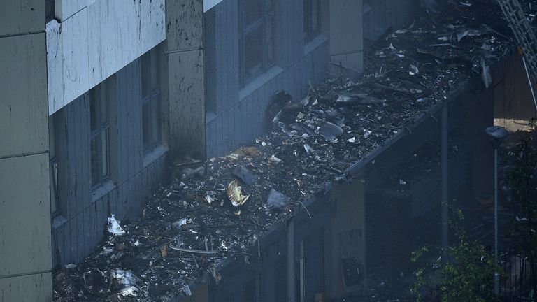 Man seen waving jumper from Grenfell window is rescued after being trapped  in burning building for 12 hours - Mirror Online