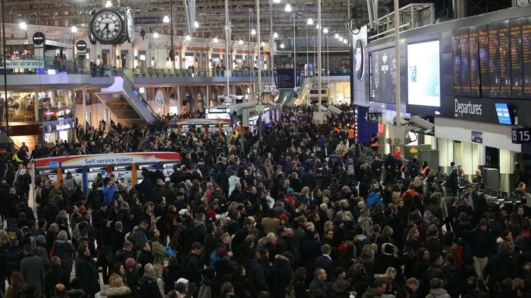 Commuters stand on the concourse at Waterloo station in central London on January 9, 2017, minutes before a 24-hour tube strike is due to end. 