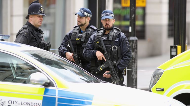 Armed police officers at a cordon on London Bridge