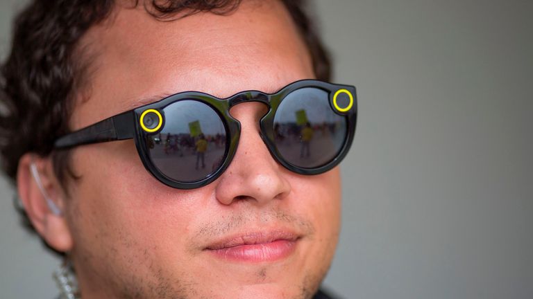 A Snap Inc employee wears its Spectacles in Venice, Los Angeles, during a protest at one of its stores