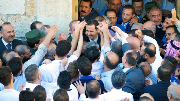 Syria&#39;s President Bashar al-Assad greets his supporters during Eid al-Fitr prayers at a mosque in Hama, in this handout picture provided by SANA on June 25, 2017, Syria. SANA/Handout via REUTERS ATTENTION EDITORS - THIS PICTURE WAS PROVIDED BY A THIRD PARTY. REUTERS IS UNABLE TO INDEPENDENTLY VERIFY THE AUTHENTICITY, CONTENT, LOCATION OR DATE OF THIS IMAGE. TPX IMAGES OF THE DAY