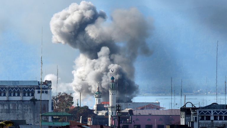 An explosion is seen after a Philippines army aircraft released a bomb during an airstrike