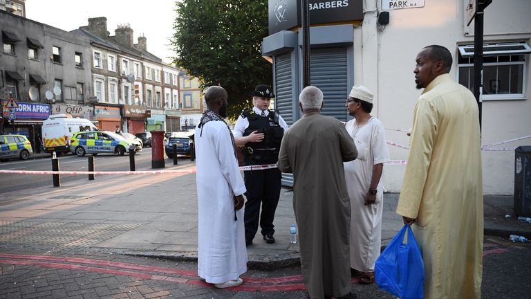 A police officer speaks to members of the local community in the wake of the Finsbury Park attack