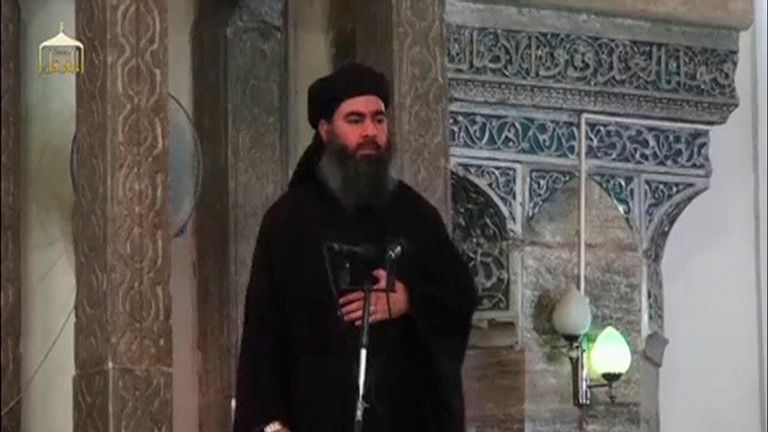Baghdadi pictured at his first public appearance at a mosque in Mosul