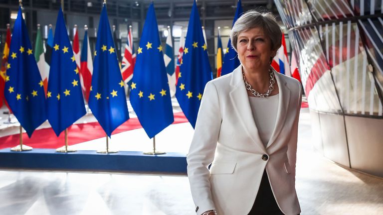 Theresa May arrives on the second day of an EU summit in Brussels