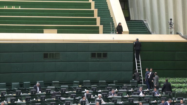 Iranian MPs attempt to continue their session amid a terror attack on their building