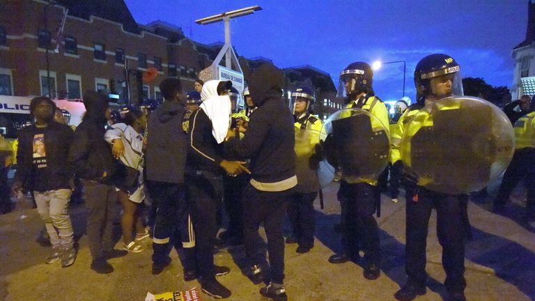 Campaigners face off with police near Richmond Road in Forest Gate