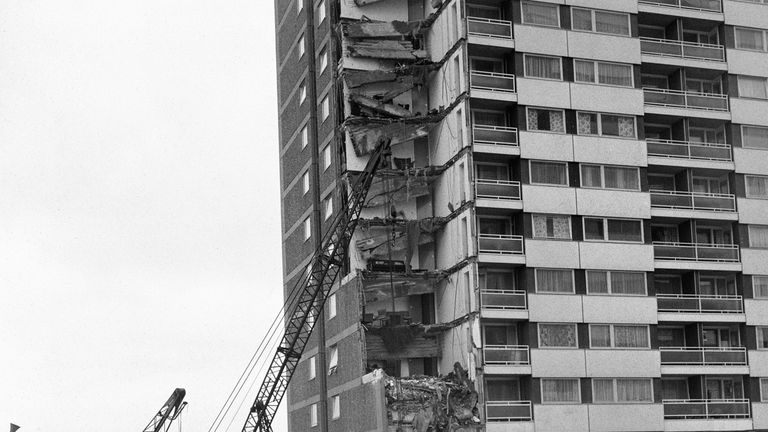 Rescue workers search debris after the collapse of a complete corner of Ronan Point, a 22 storey block of flats at Canning Town in the east End of London