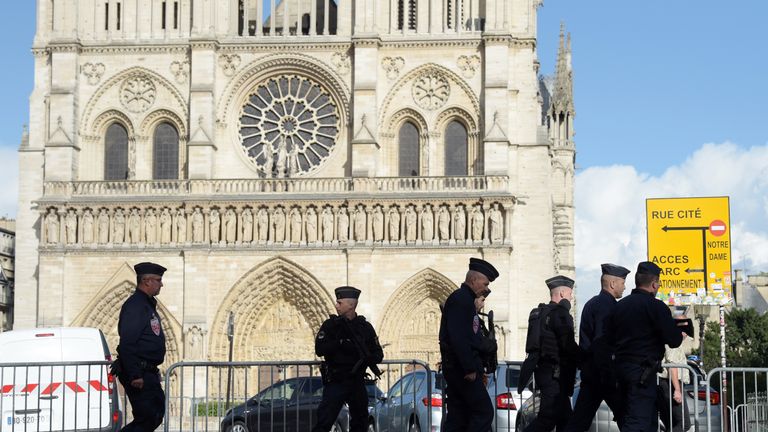 Police patrol the Notre Dame neighbourhood in Paris after a man attacked police officers with a hammer on 6 June.