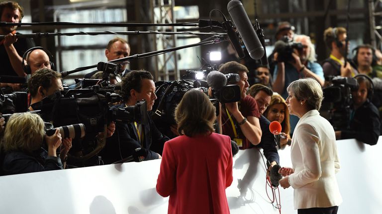 Theresa May speaks to the press after arriving at the EU summit