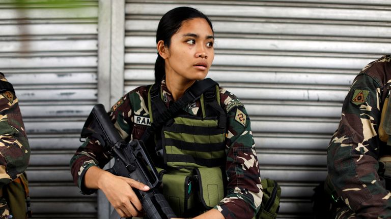 A Philippines army soldier takes a break as government forces continue their assault