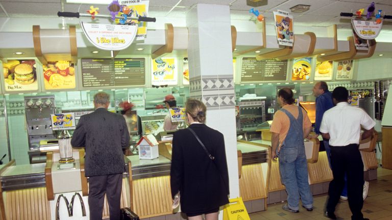 People queue up at a McDonalds in the 1990s