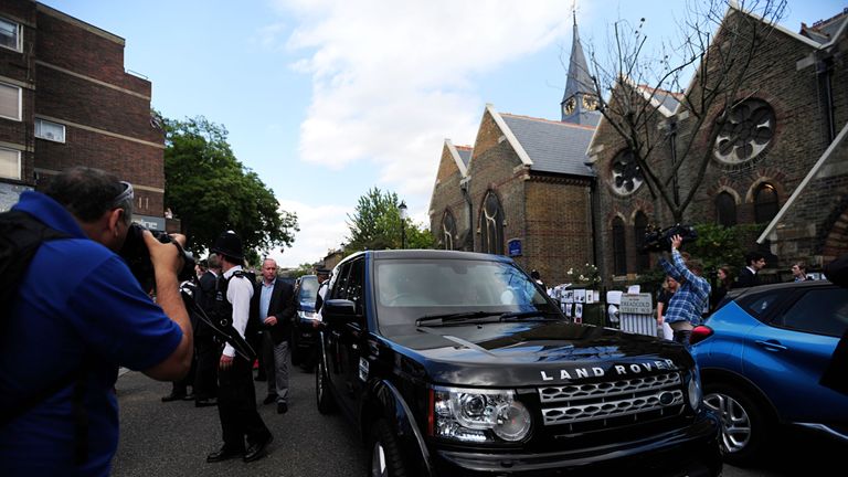 The PM leaves St Clement&#39;s Church in west London under police escort