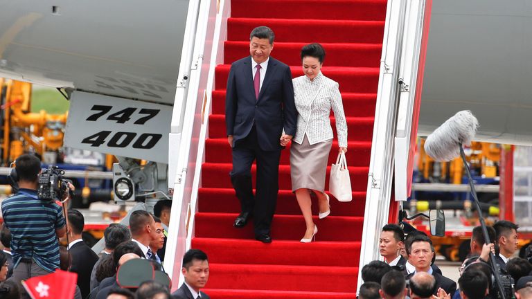President Xi Jinping arrives in Hong Kong with his wife